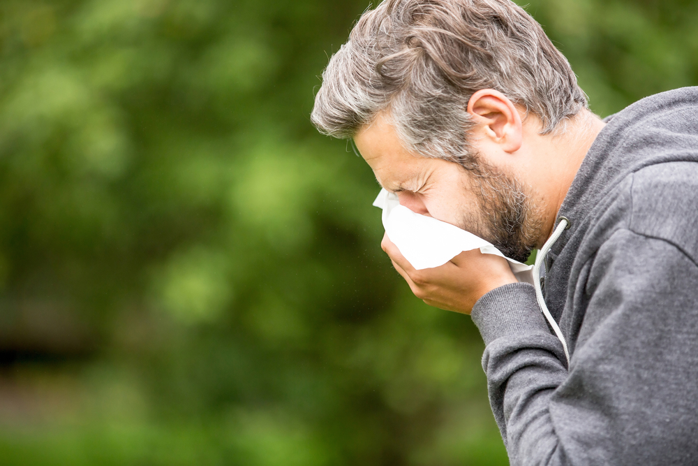 Man,With,Allergy,Or,An,Infection,Sneezing