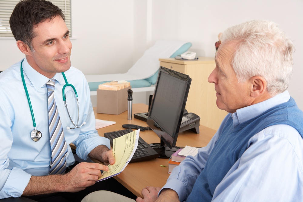 older man talking to doctor