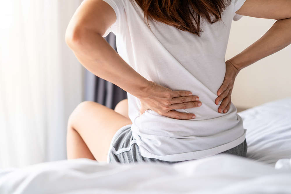 woman with lower back pain from kidney stone
